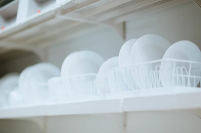 Close-up of clean, neatly stacked hospitality supplies ready for delivery.