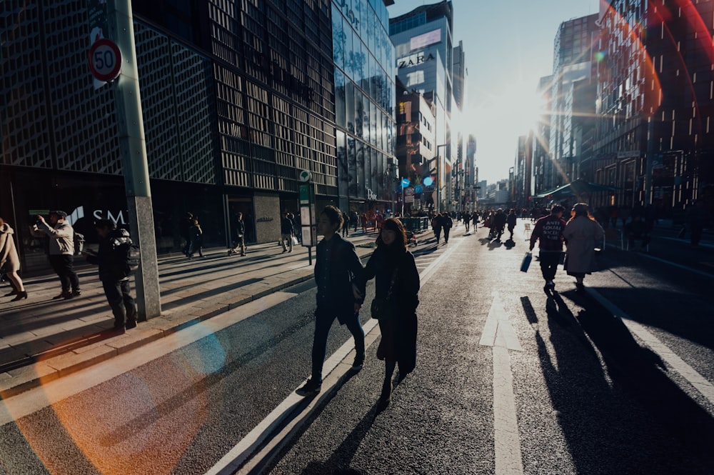 man and woman crossing on street