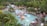 A serene aquatic park with colorful water slides and lush greenery.
