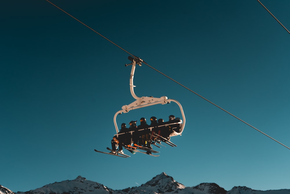 people riding a cable car
