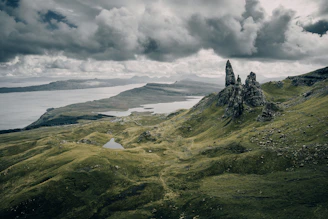 The Old Man of Storr rock formation above a green valley on Skye