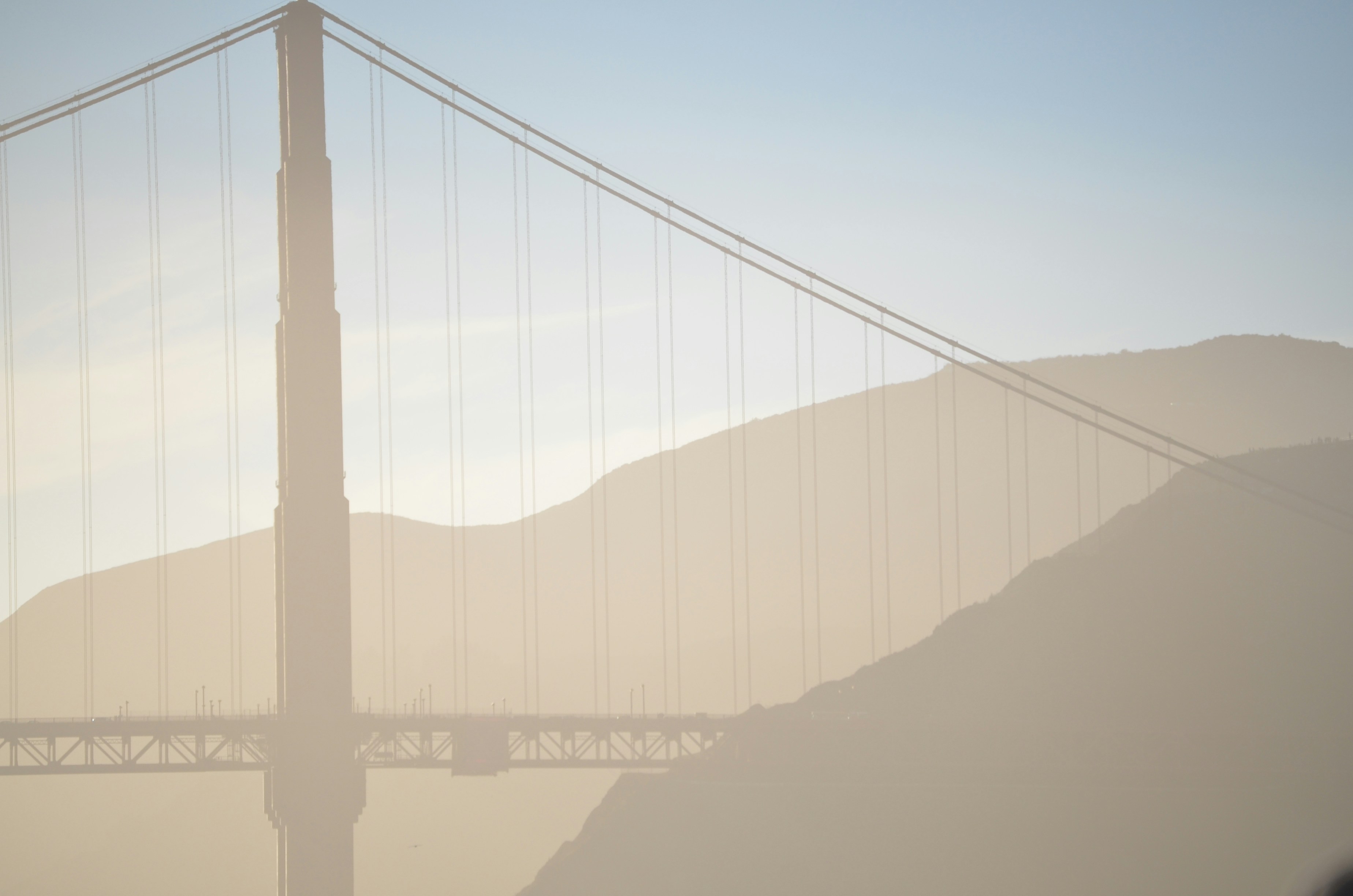 suspension bridge near mountain silhouette illustration