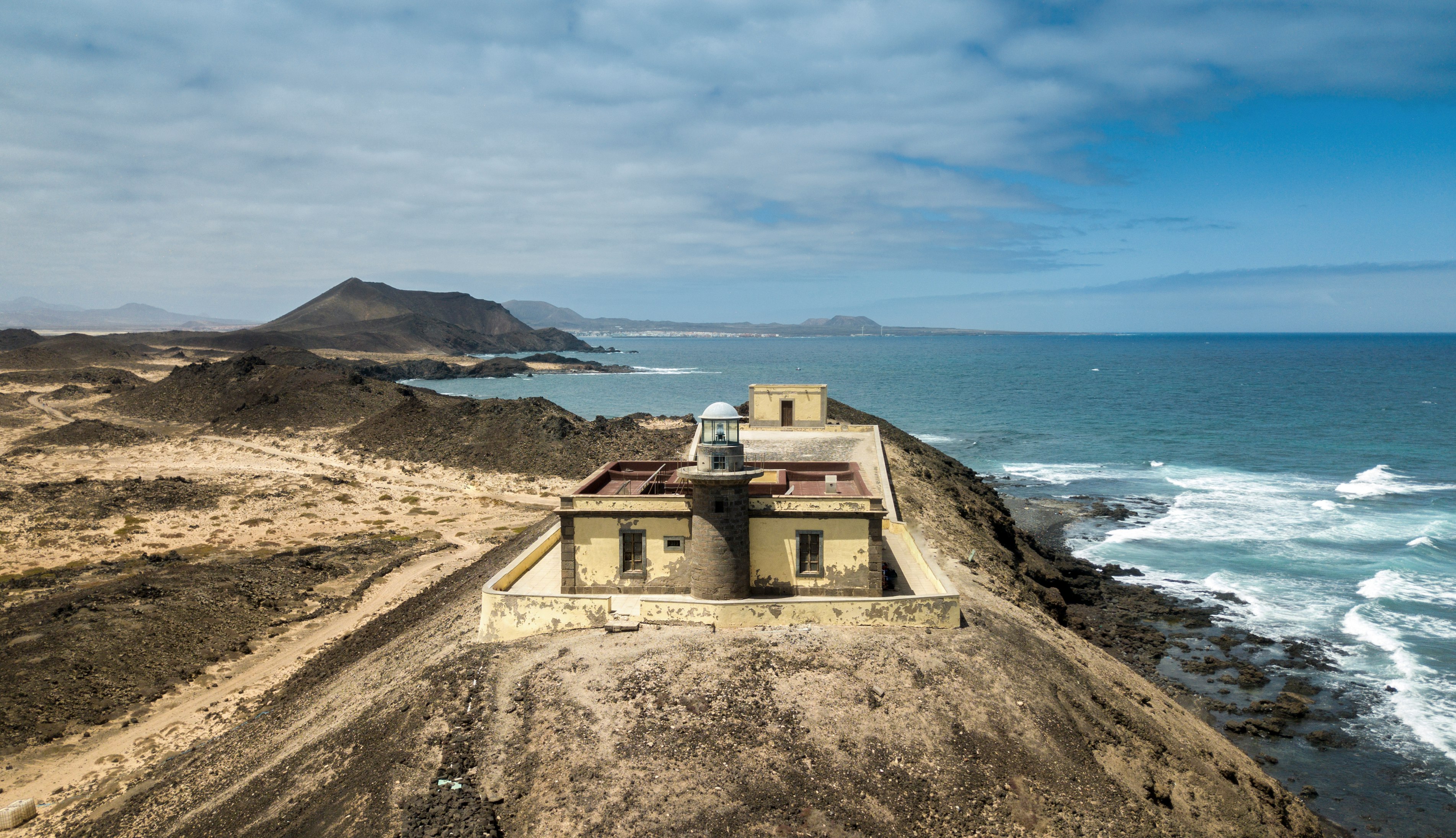 aerial photography of building near body of water