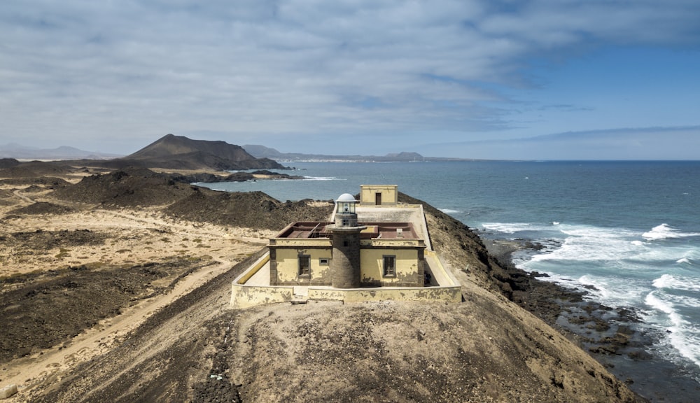 aerial photography of building near body of water