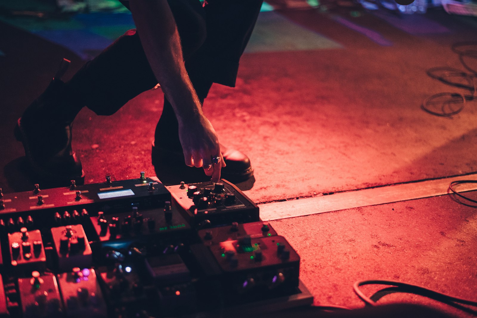 Nikon AF-S Nikkor 50mm F1.8G sample photo. Person holding guitar pedal photography