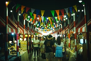 A vibrant street market in Chiang Mai bustling with colorful stalls and smiling locals.