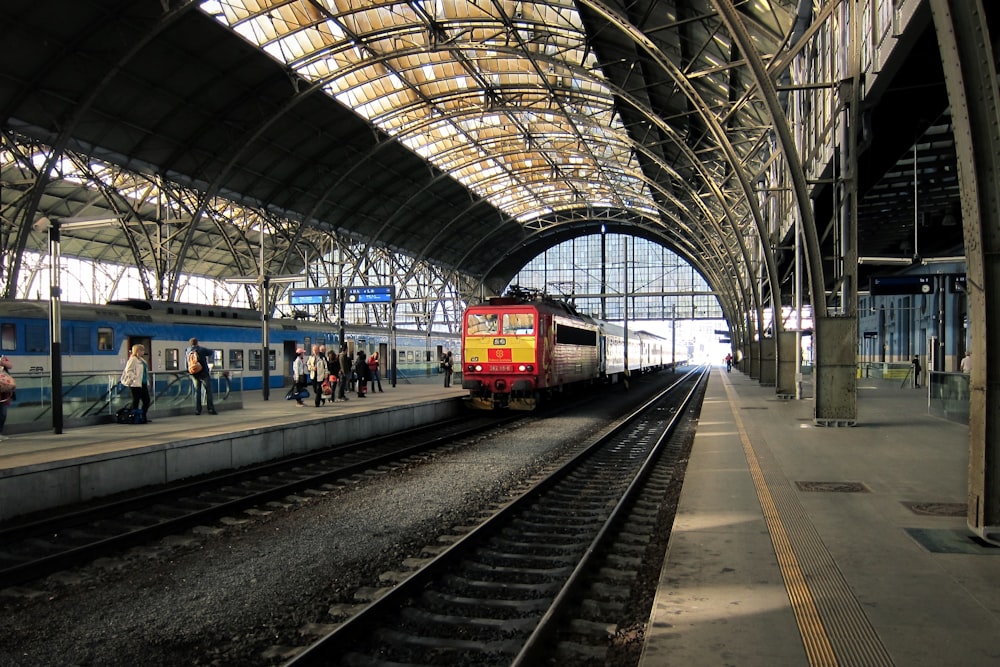 people standing near train