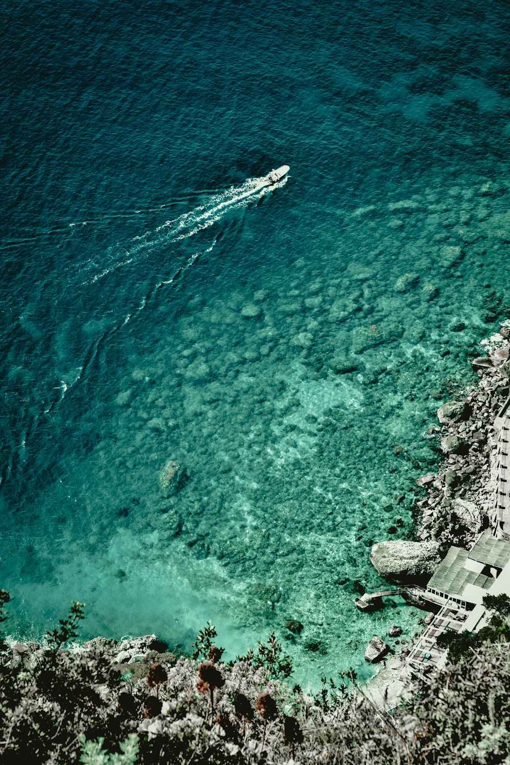 boat at sea during daytime in aerial photography