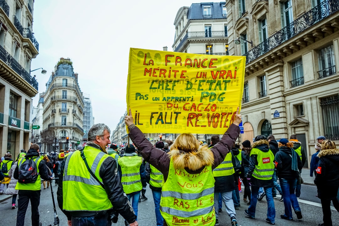 people wearing safety vest doing parade on road