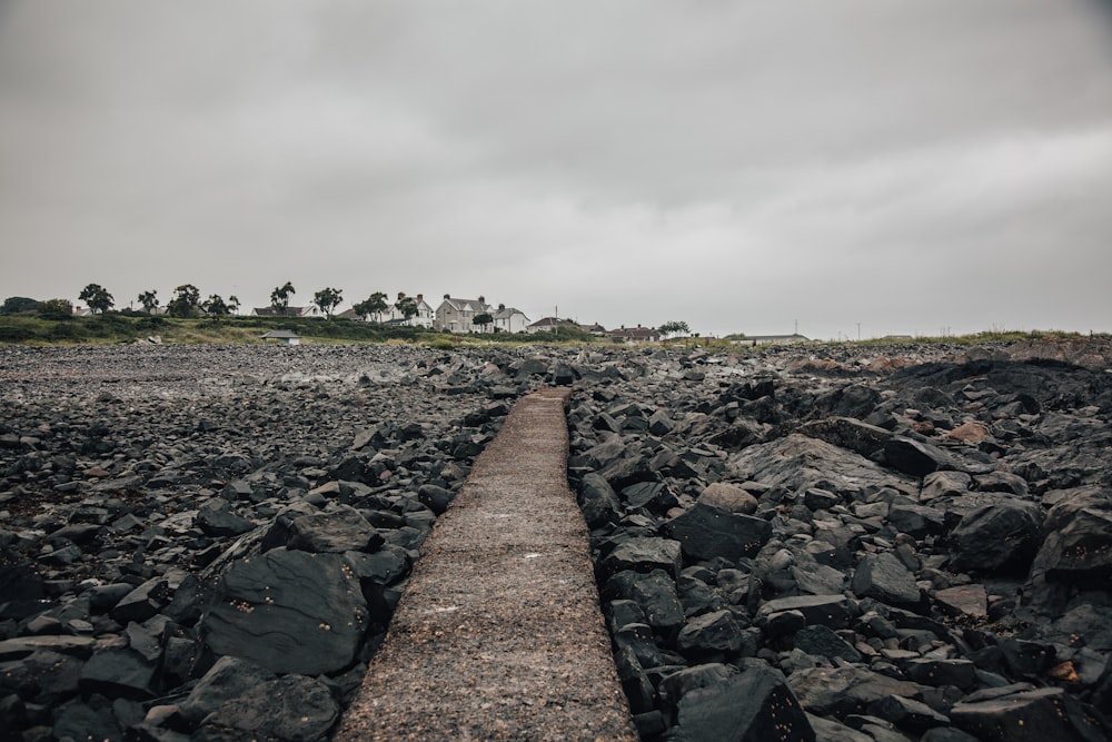 empty pathway on rock terrain during daytime