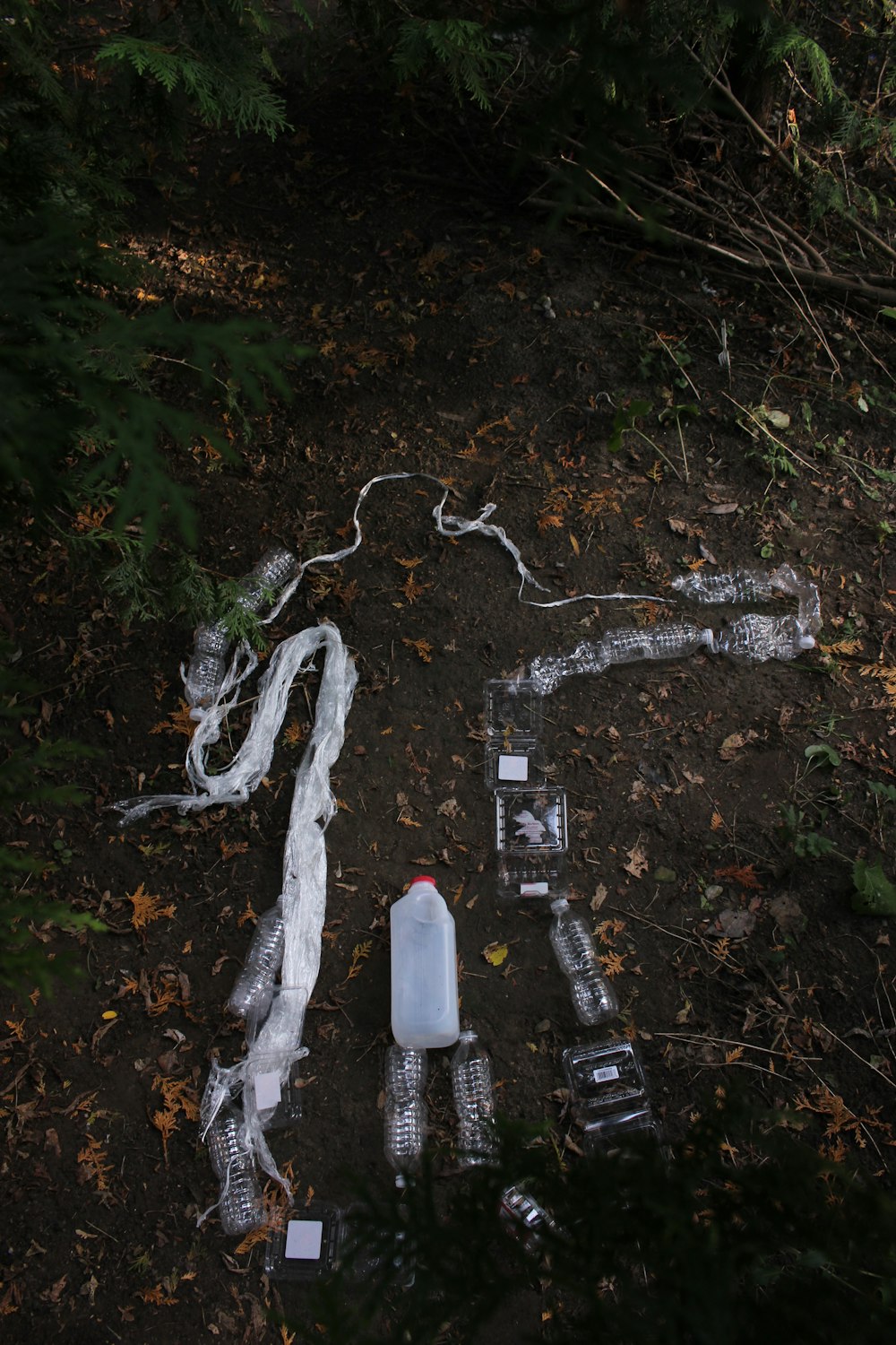 white plastic bottle on brown field