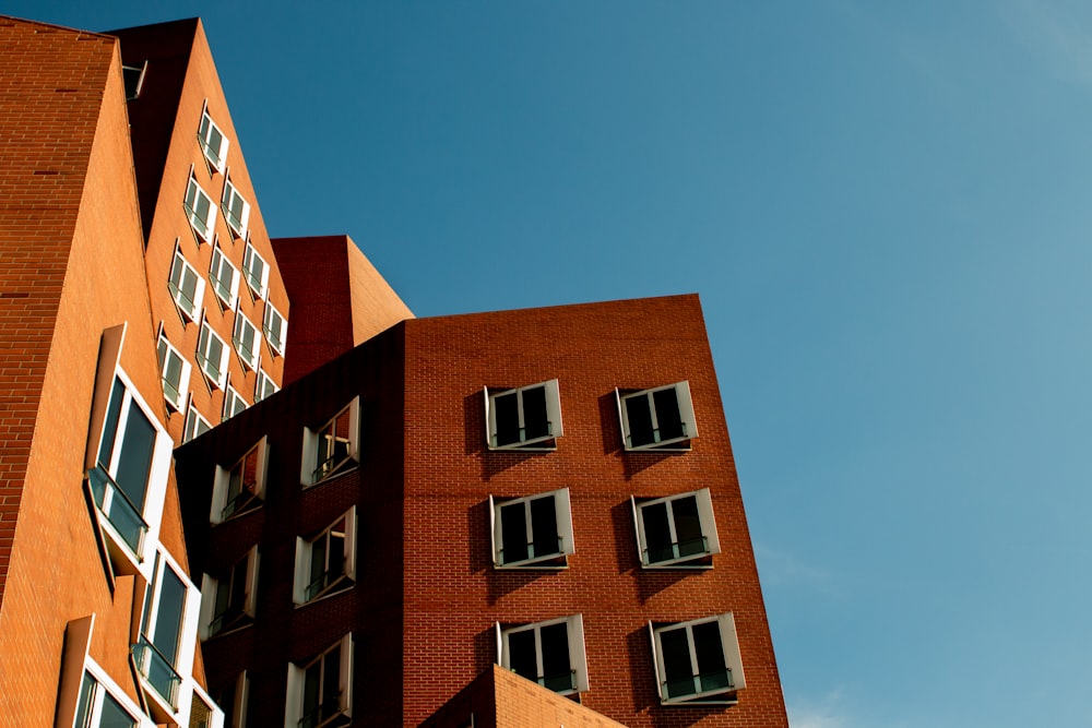 low-angle photo of brown painted concrete building