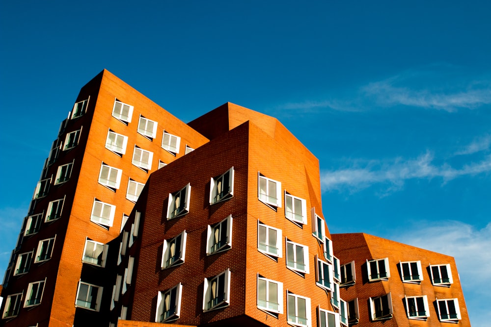 brown concrete building under cloudy sky