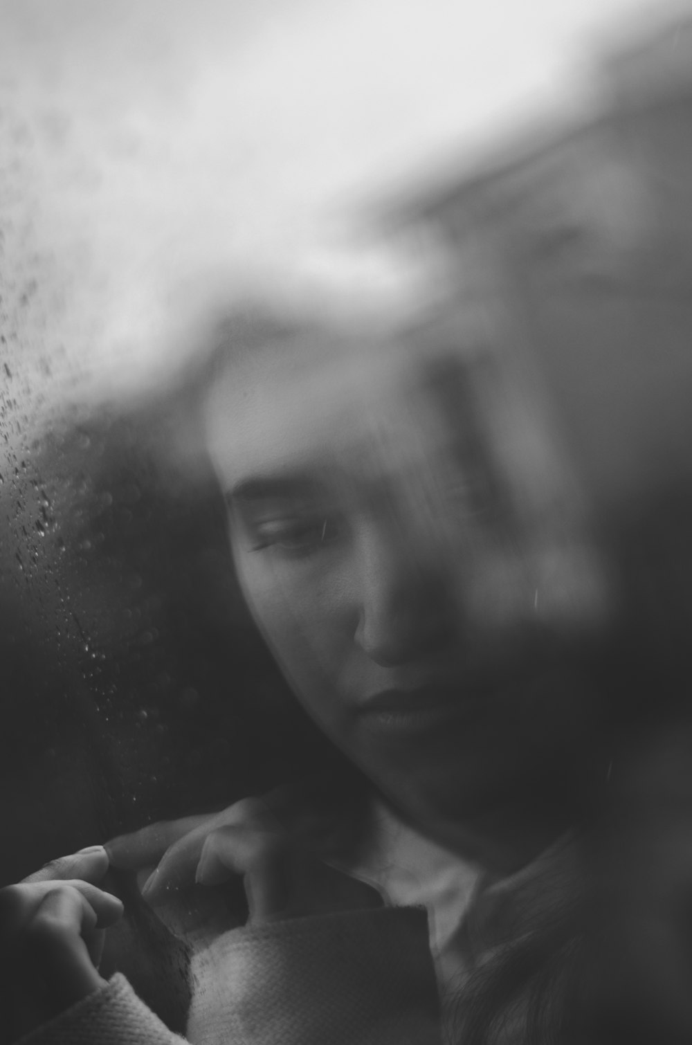 greyscale photo of woman inside car