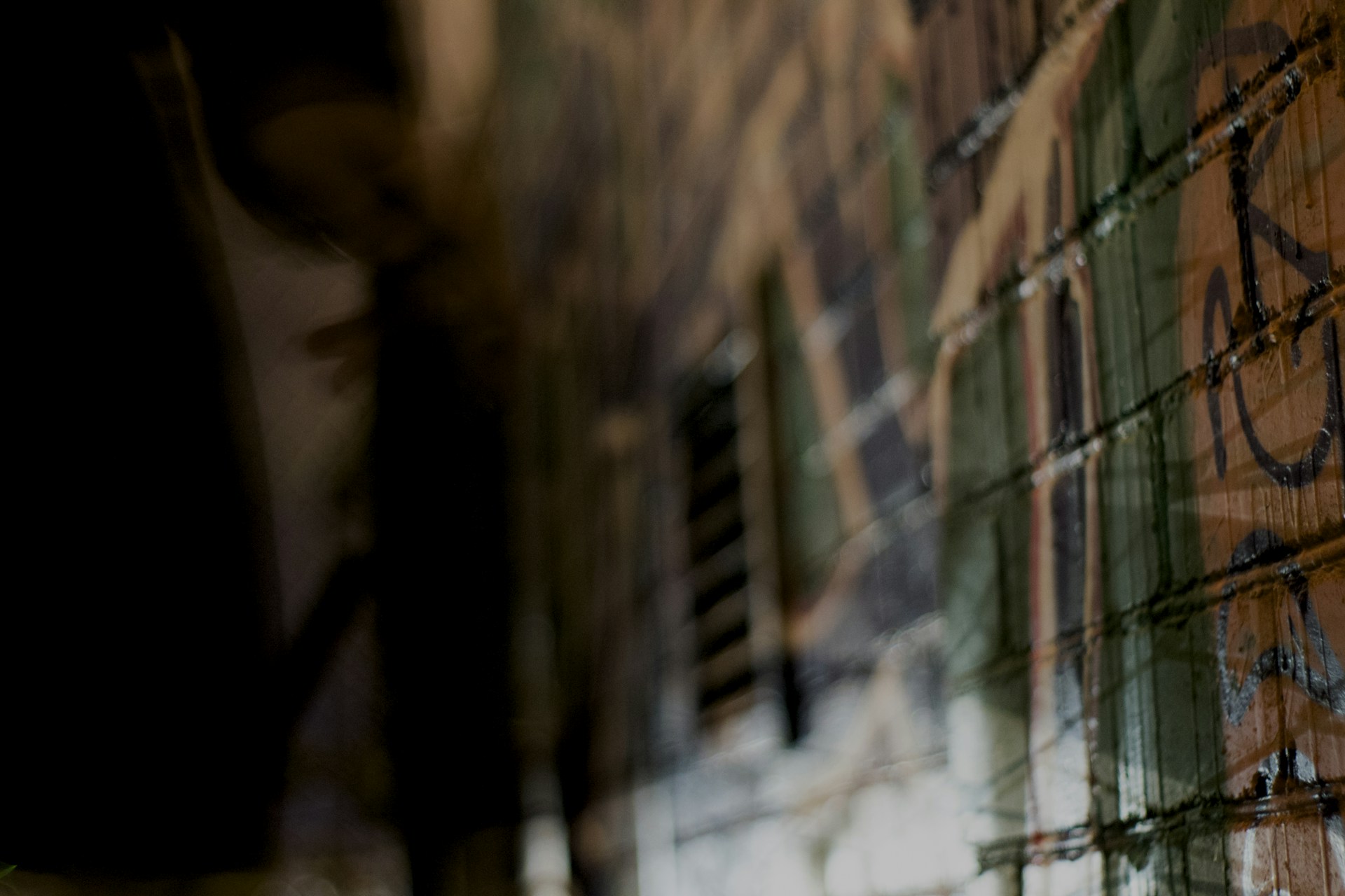 A close-up shot of intricate urban textures and vibrant graffiti, highlighting details and colors