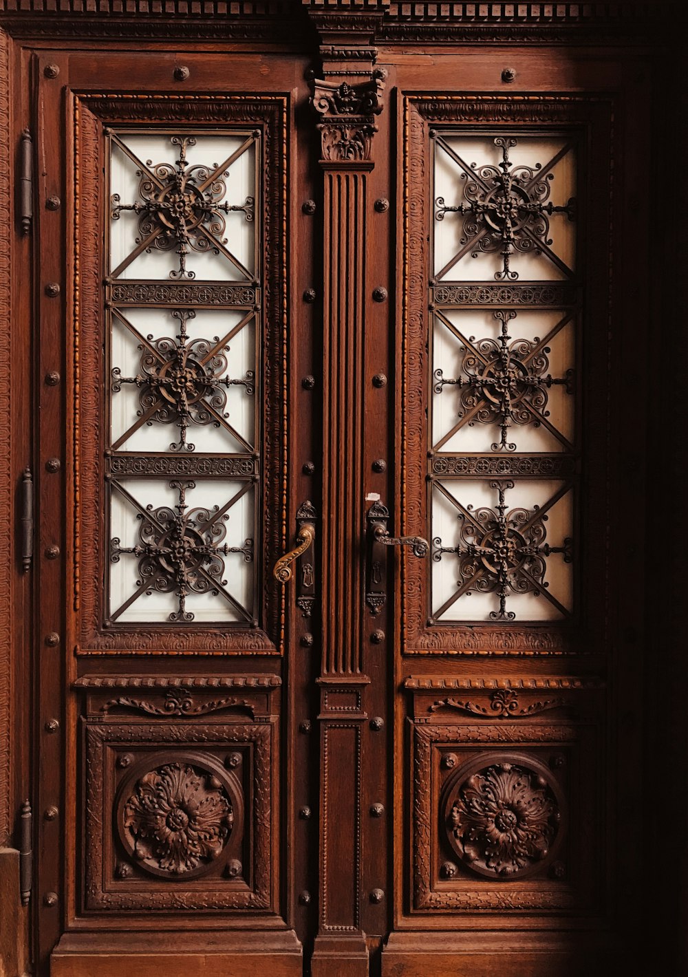 brown wooden floral carved door