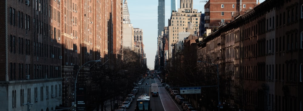 cars on road near buildings during daytime