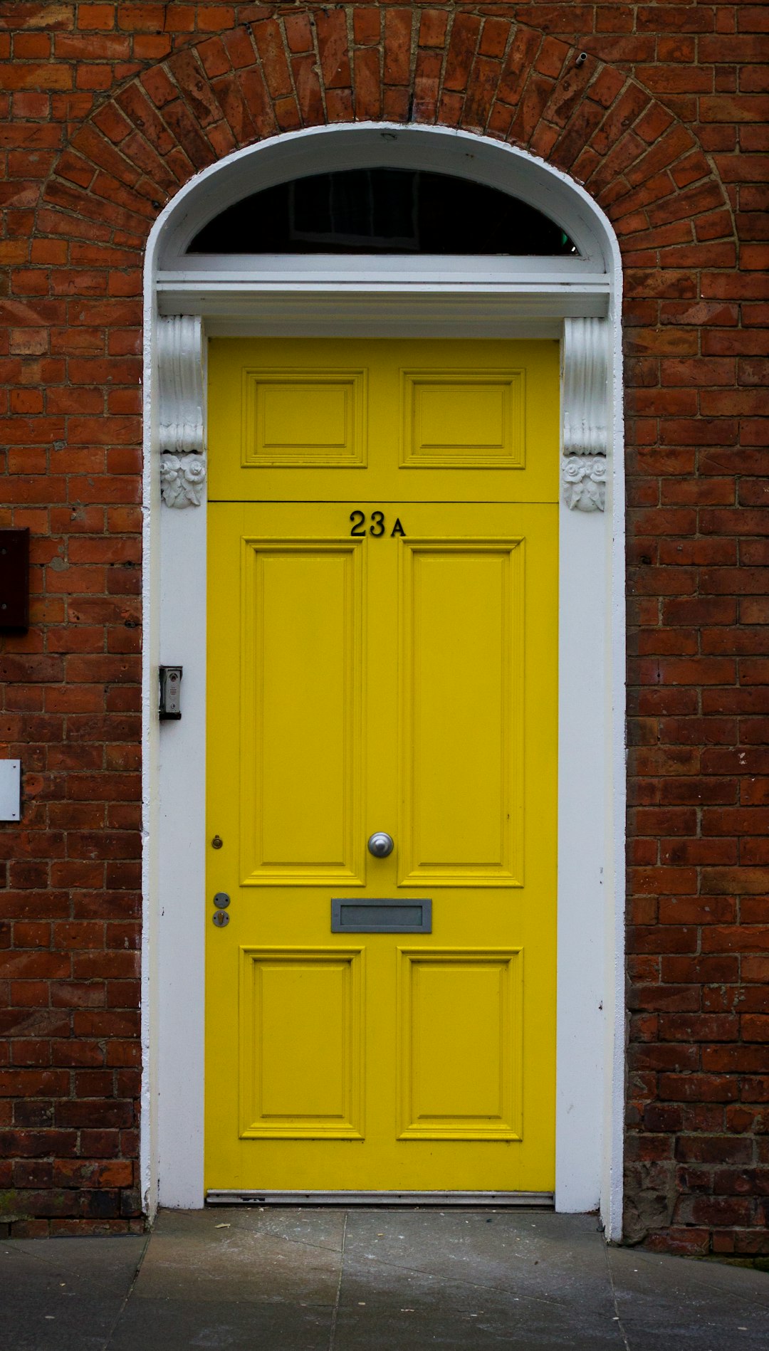  yellow wooden door is close door frame