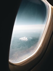 A scenic landscape viewed from an airplane window.
