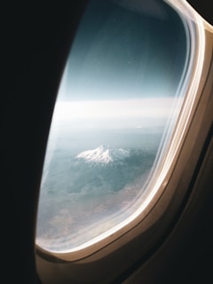 A scenic landscape viewed from an airplane window.