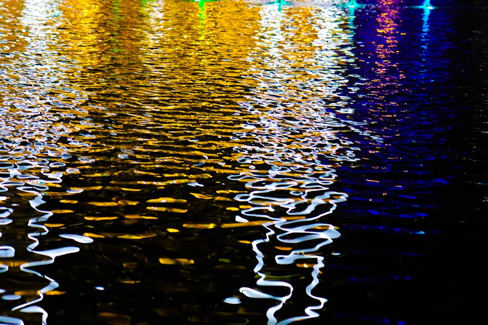 lights reflecting on body of water