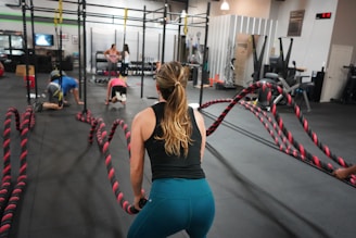 woman in black top pulling rope