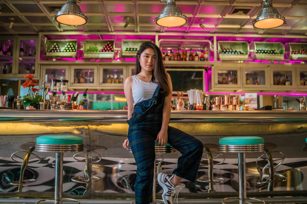 close-up of woman seated near bar