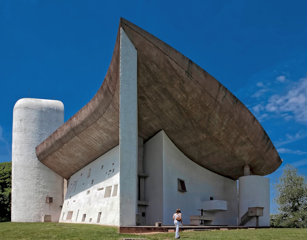 person standing in front of white building