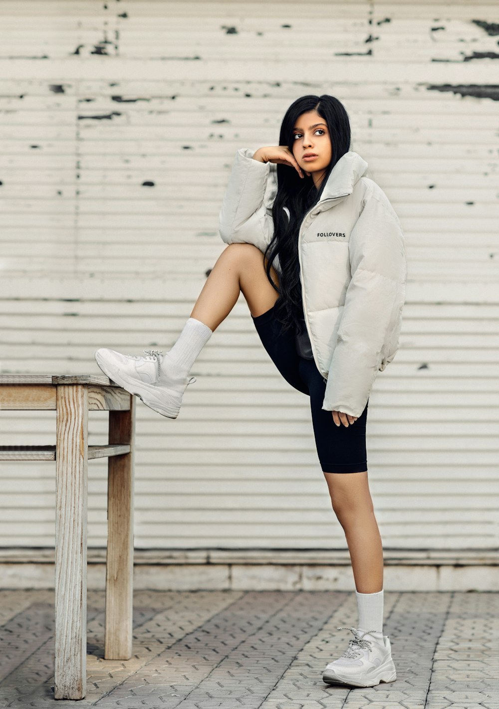 standing woman wearing white jacket