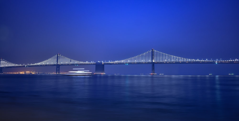 gray bridge under blue sky