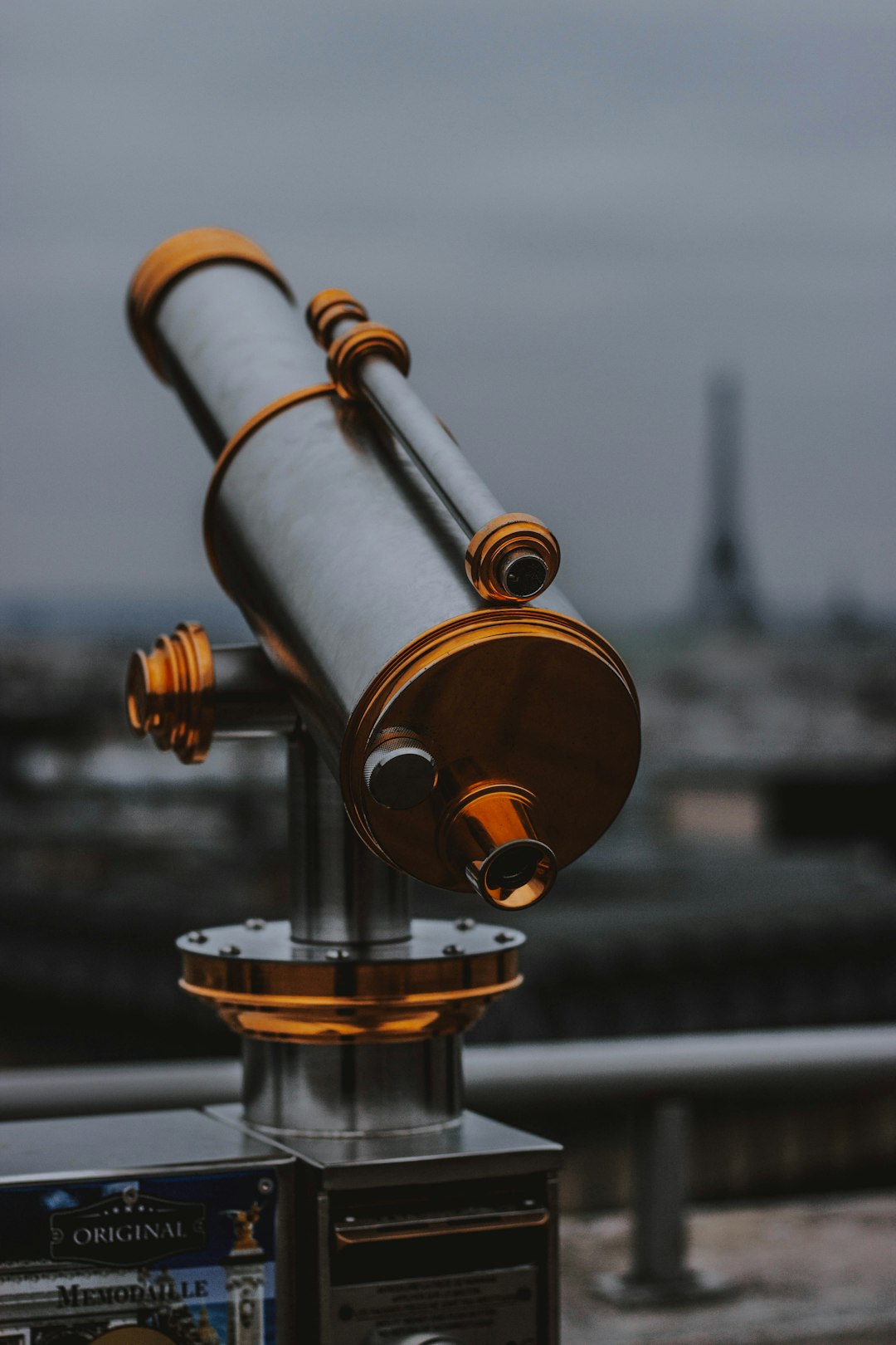 brass-colored and black telescope during daytime