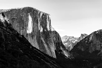 A large, vibrant photograph showcasing a dramatic landscape with rich colors and deep shadows.