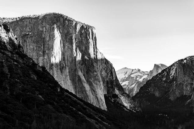 A large, vibrant photograph showcasing a dramatic landscape with rich colors and deep shadows.