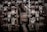 Complex machinery parts with heavy rust and wear, featuring interlocking gears and metal components. The image captures intricate details of industrial equipment showcasing bolts, nuts, and mechanical textures.