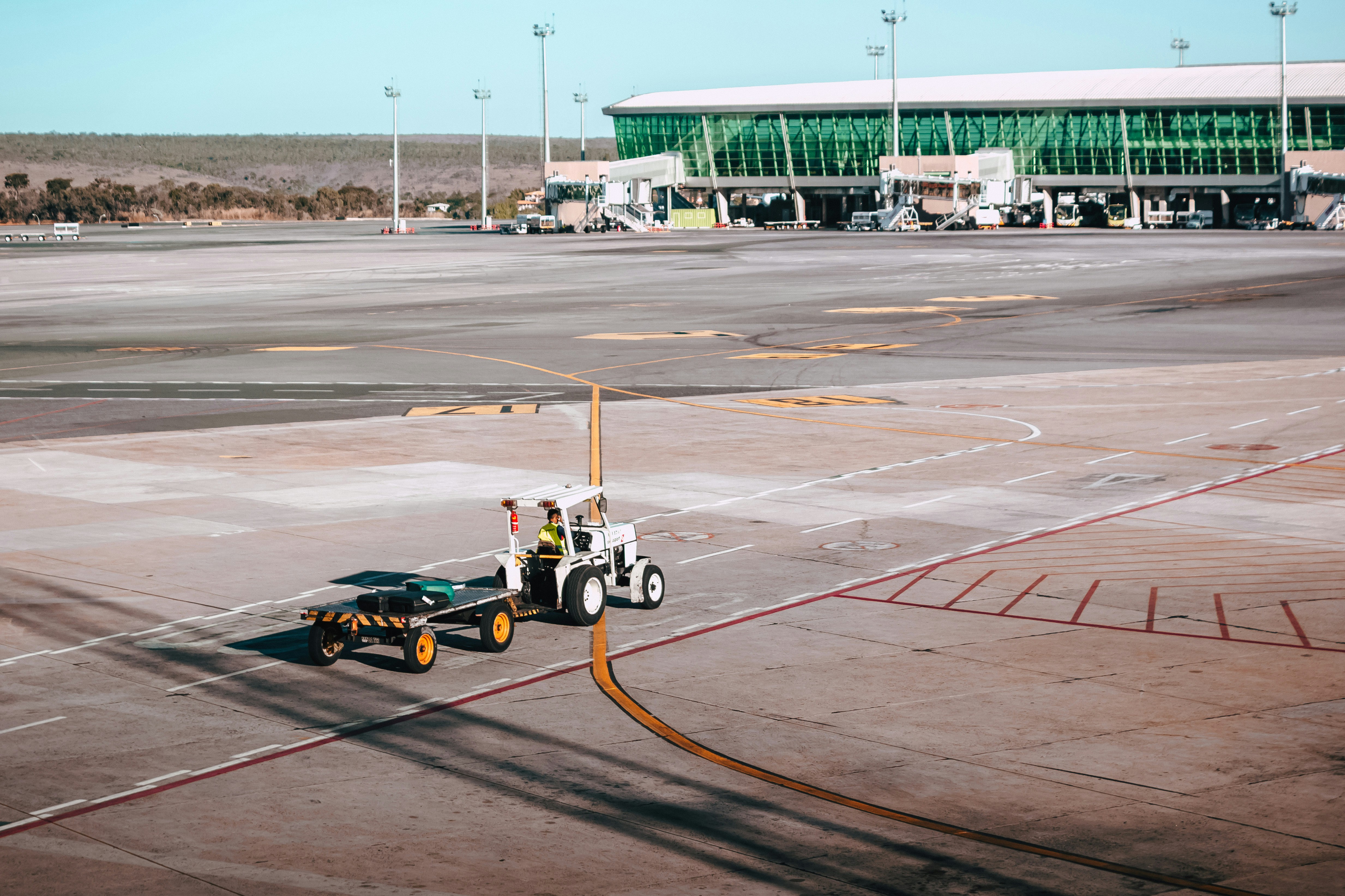 aerial photography of tow trailer in an airport, 