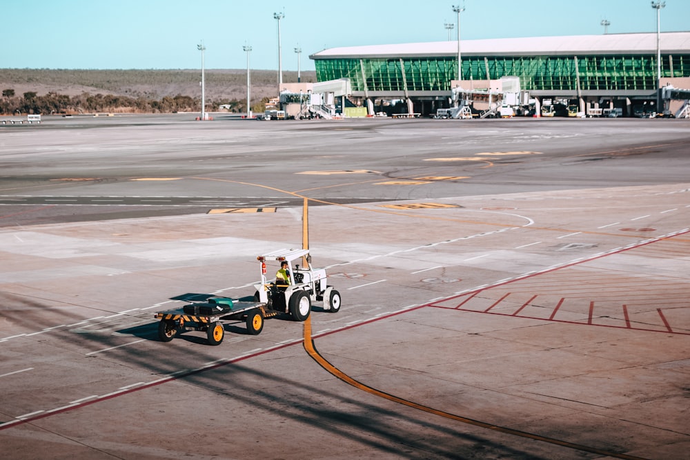 aerial photography of tow trailer in an airport