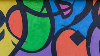 A vibrant street mural showcasing colorful abstract shapes.