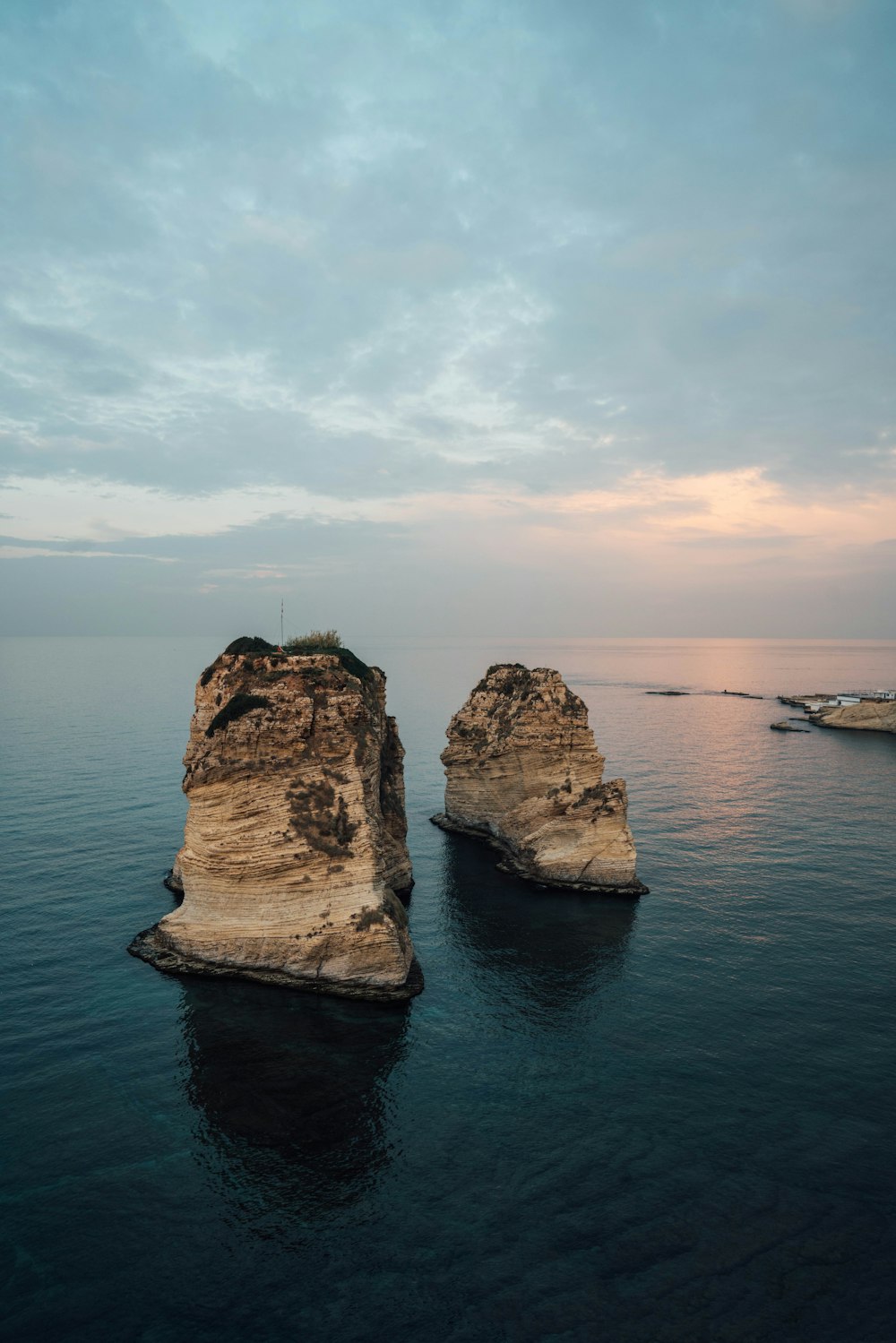 rock on body of water