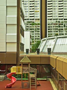 Technician repairing a large playground slide with tools
