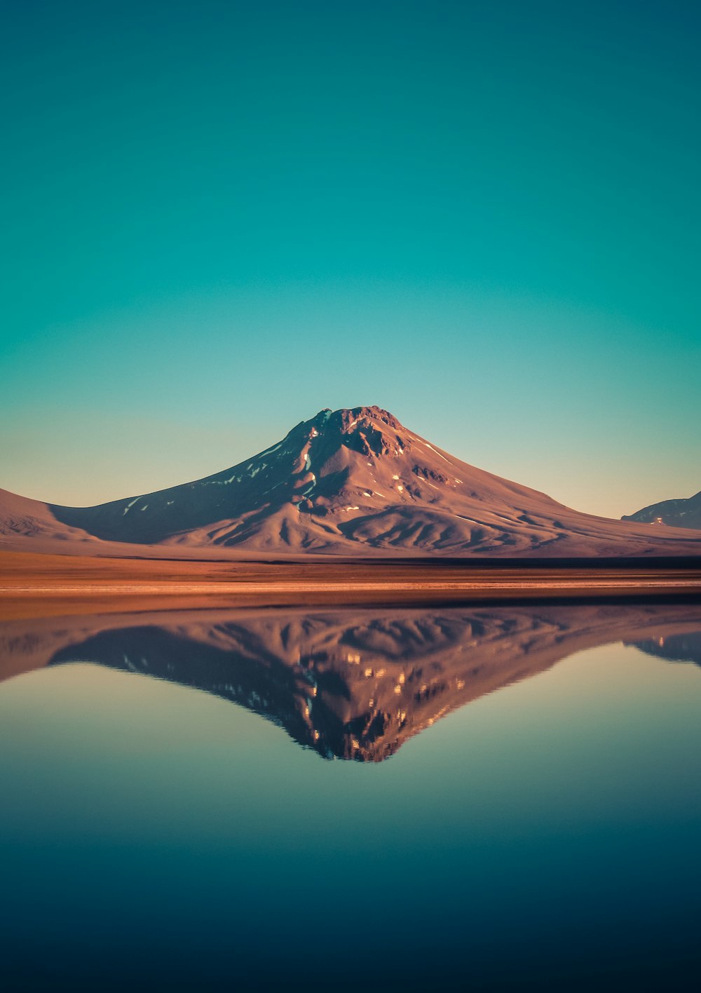 mountain near body of water view