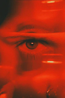 close-up of eye in red light