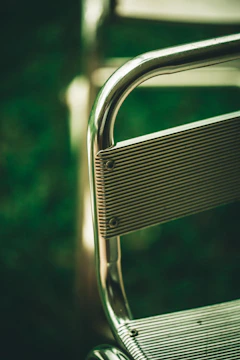 Close-up of a curved chair armrest designed to mimic ski shapes.