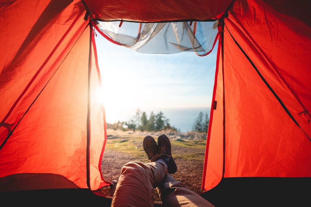 person lying inside tent