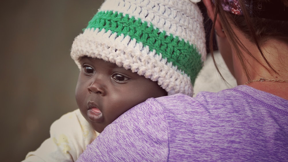 woman carrying baby