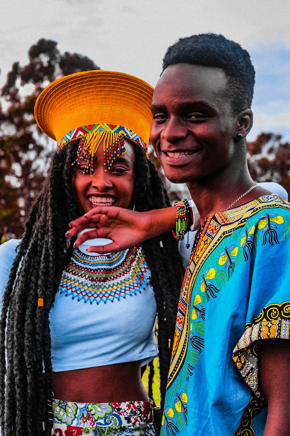 smiling woman standing near man