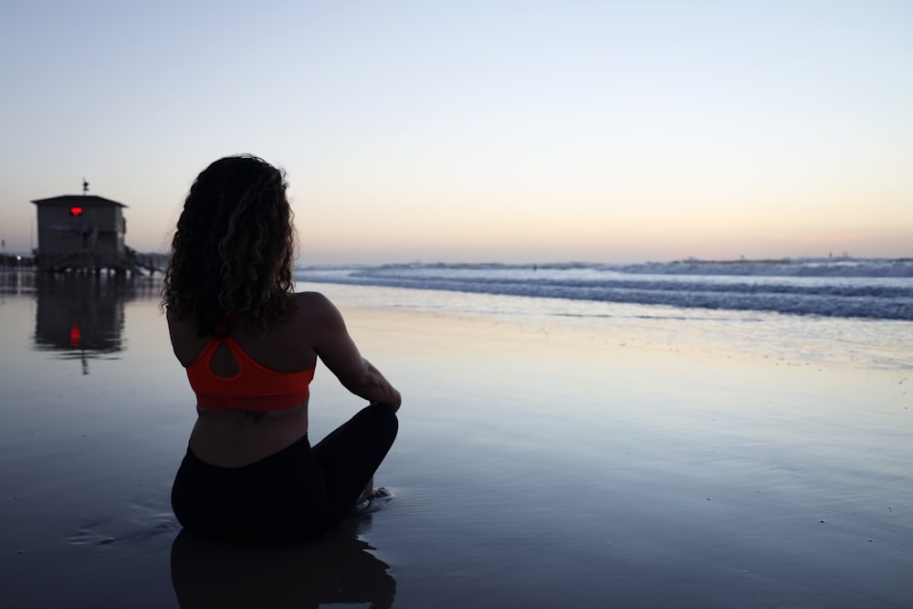 woman seated on shore