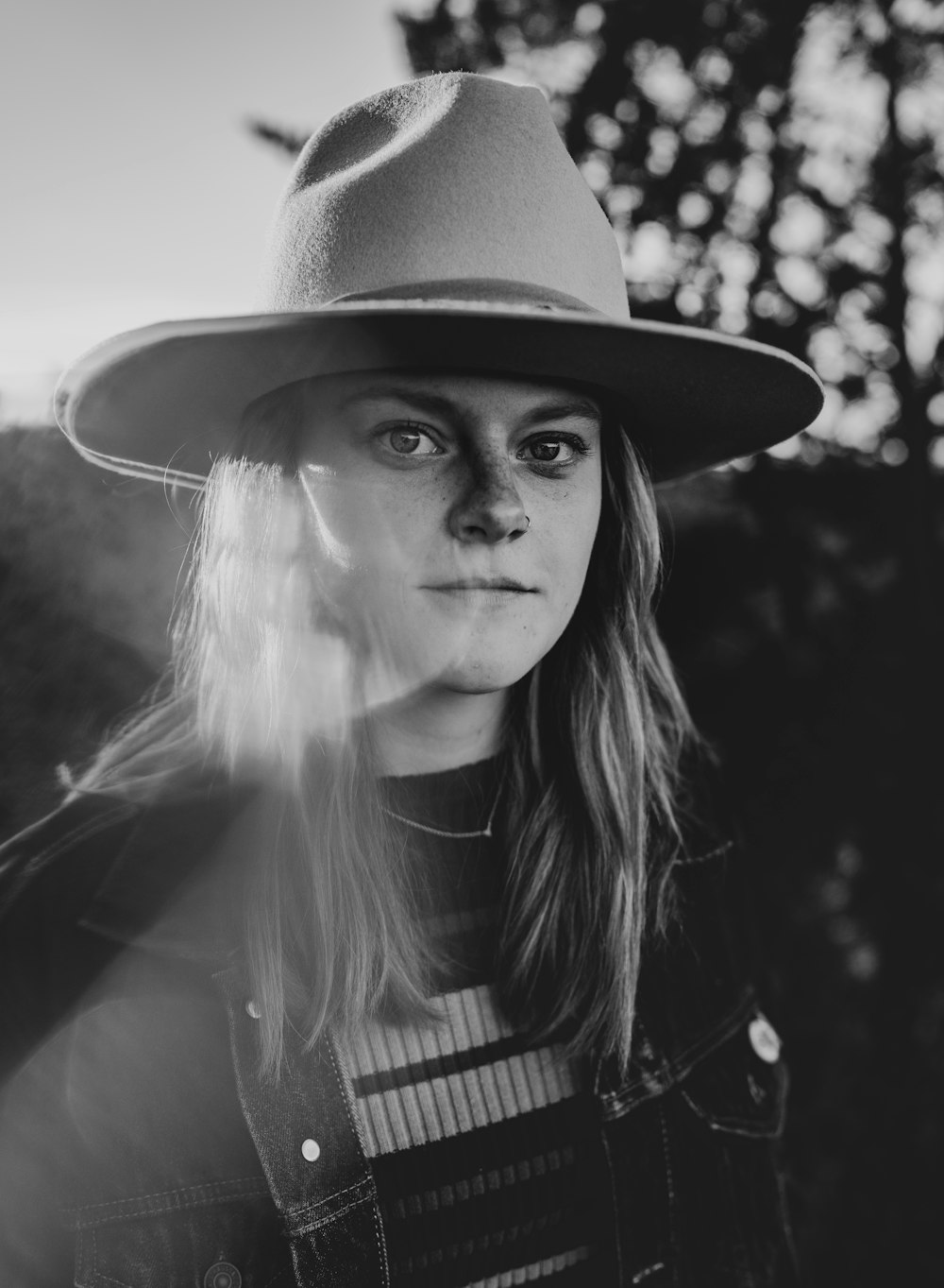 long haired woman wearing cowboy hat