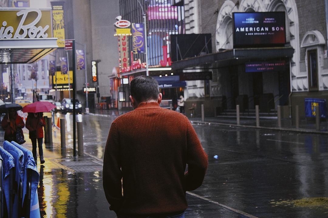 man waling on sidewalk