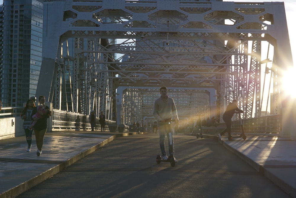 man using balance board on bridge