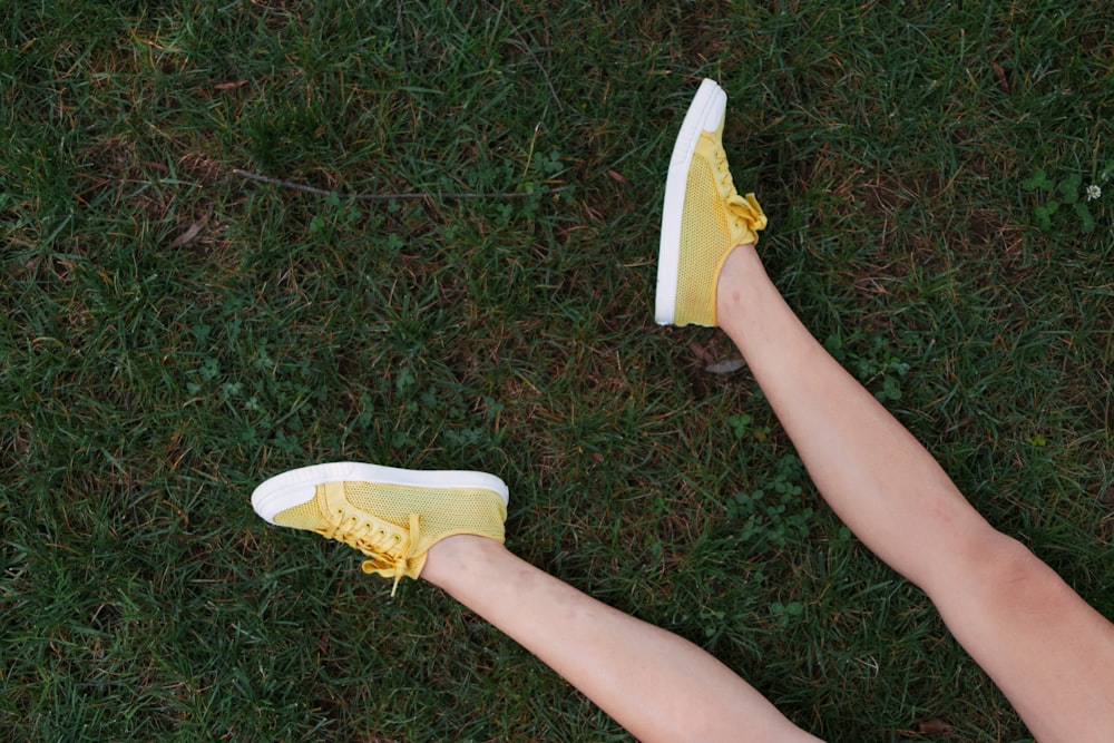 yellow-and-white low-top sneakers